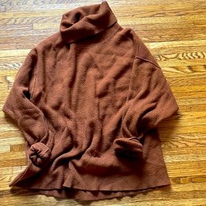 Rust colored Free People Ribbed Turtleneck size small (but fits like a large)